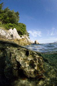 Split level of a Croatian rocky shore line.  Natural ligh... by Paul Colley 
